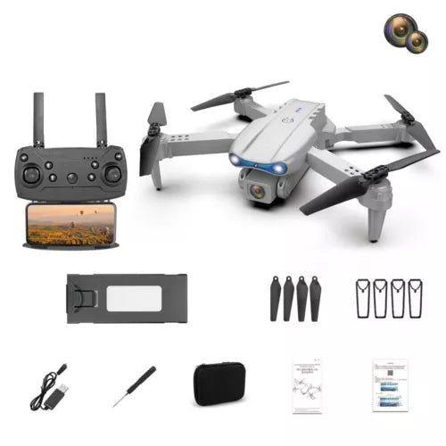 White quadcopter drone with controller and accessories, including propellers and case