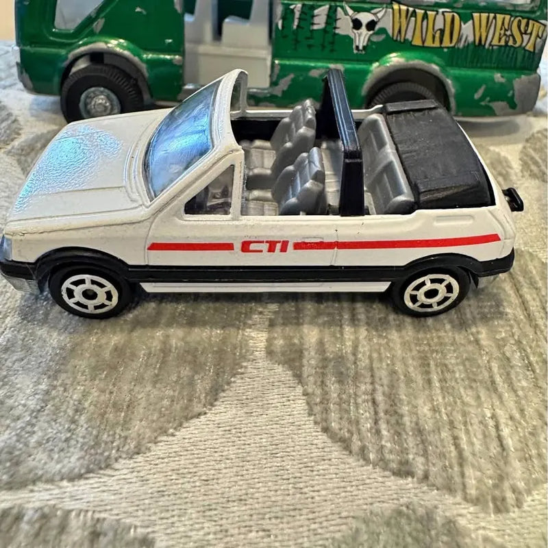 Vintage Majorette diecast car, white with CTI logo and open hood detail
