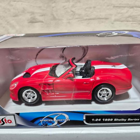 1:24 red Shelby Series 1 diecast convertible model car with black interior and chrome wheels