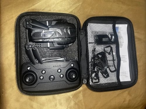 Foldable quadcopter drone in zippered carrying case with remote control