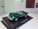Green Daimler SP250 convertible diecast model car on display base with chrome details