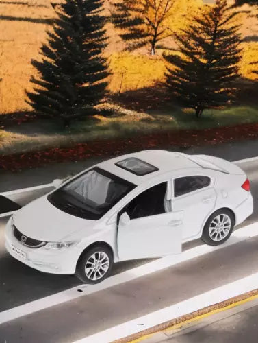 White Honda Civic 1:36 diecast model car, four-door sedan profile