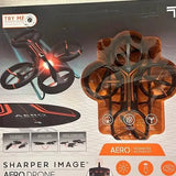 Aero drone with black-and-orange body, four rotors, shown in retail packaging