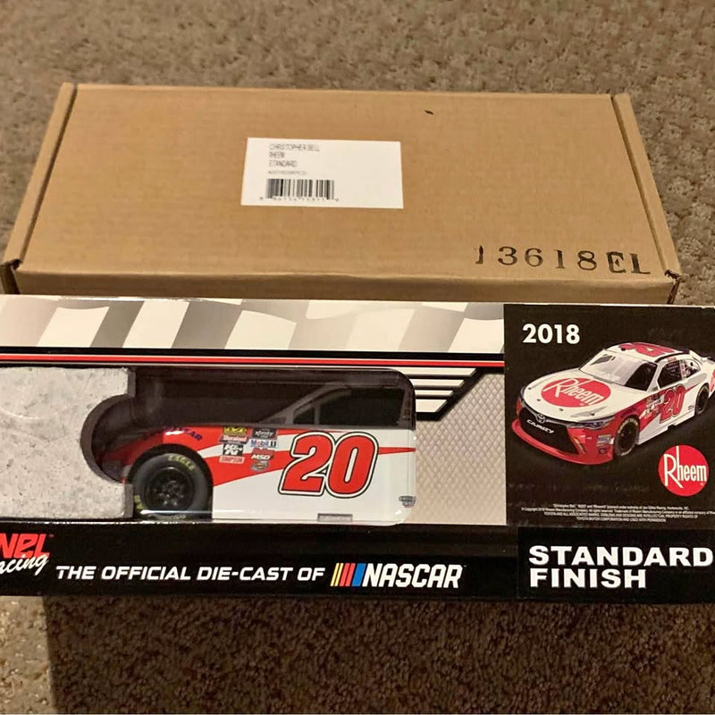 1:24 diecast race car in box, white and red #20 with sponsor logos