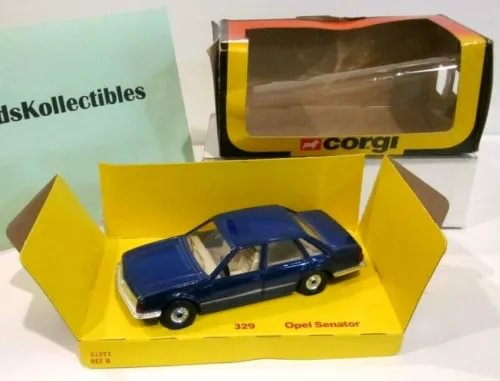 Blue Opel Senator 329 diecast car in yellow display box with clear lid