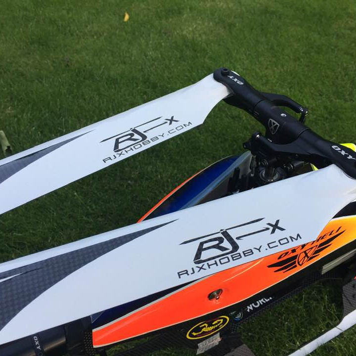 Carbon fiber RC helicopter main blades, white with black and orange graphic markings