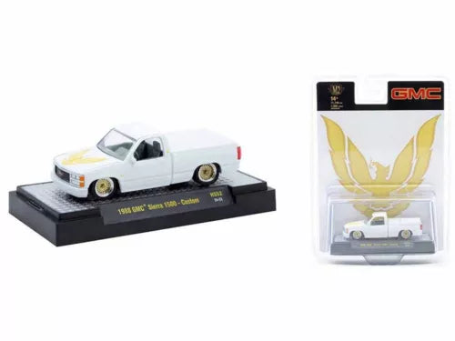 White 1/64 diecast 1988 GMC Sierra 1500 custom pickup model car on display base