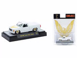White 1/64 diecast 1988 GMC Sierra 1500 custom pickup model car on display base