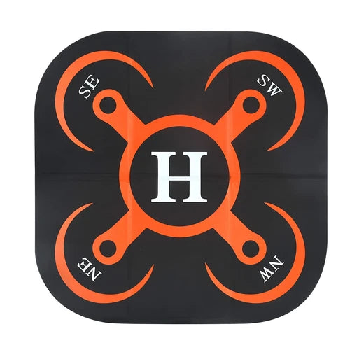 Black and orange drone landing pad with H emblem and four corner markings