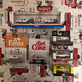 Diecast toy vehicle display with buses and cars in retail packaging