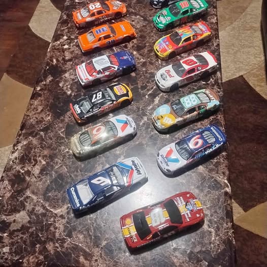 Diecast NASCAR stock car set with multiple numbered cars in assorted liveries