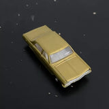 Yellow diecast toy car with silver windshield, front three-quarter view