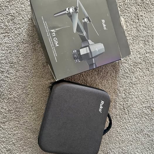 Black zippered Ruko drone carrying case with logo, hard shell