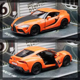 1/36 scale orange diecast sports car model, front 3/4, black wheels