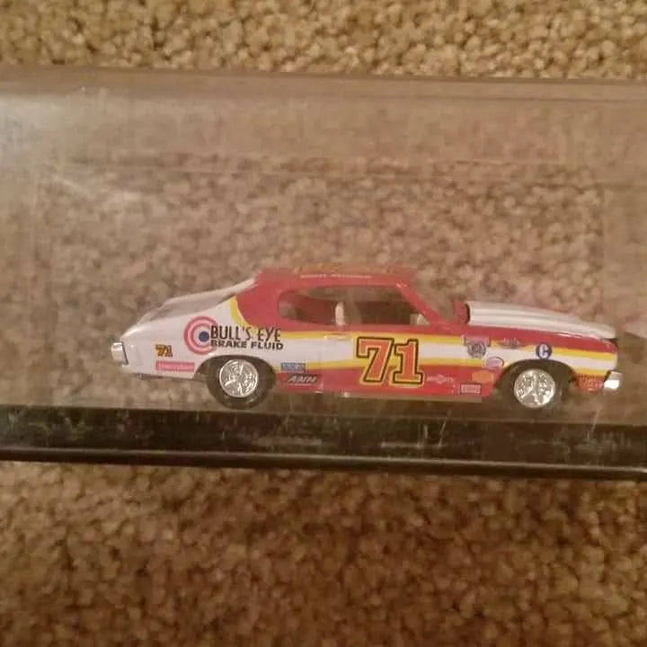 Diecast race car model, red and white, side view with #71 on door