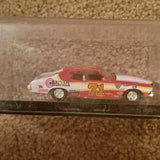 Diecast race car model, red and white, side view with #71 on door