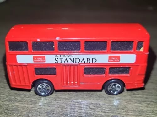 Red diecast toy bus with "The London Standard" signage and detailed grille and windows