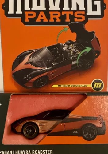 Pagani Huayra Roadster diecast car with moving parts, in orange packaging