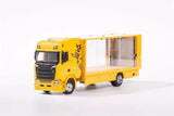 Yellow enclosed double-deck tow truck diecast model with white side panels, 1:64 scale.