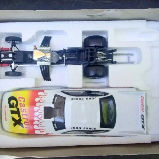 1/24 diecast drag racing car model in box, yellow and black Castrol livery