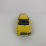 Yellow diecast race car model, front view, 1:36 scale, Evo-style with black windshield