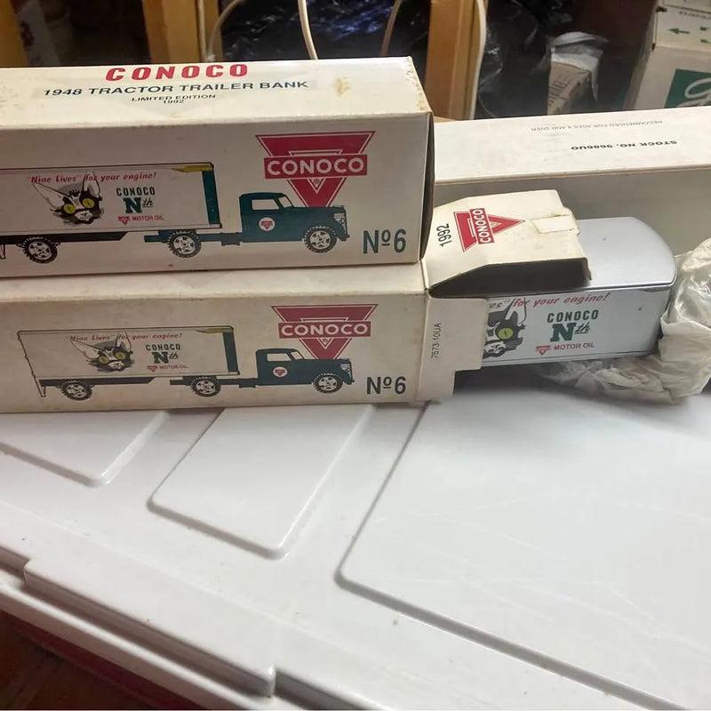 Diecast toy trucks and cars set, boxed, with Conoco logos on vehicles