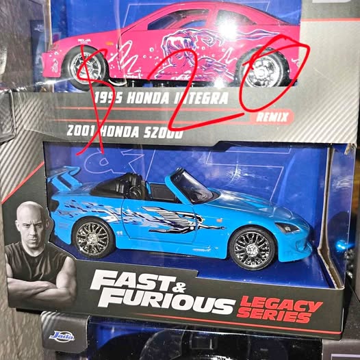Blue diecast toy car in blister box packaging, black wheels, Fast & Furious Legacy Series