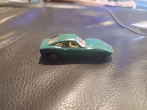 Metallic green diecast Opel GT model car, 1:64 scale, front-left view