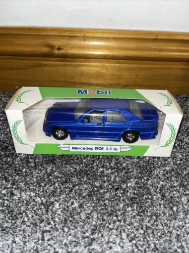 Blue diecast Mercedes 190E toy car in Mobil branded display box, scale 1:36