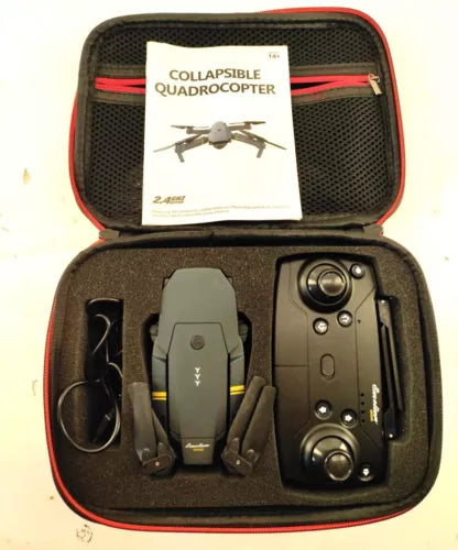Collapsible quadrocopter drone in original case with controller and charging ports