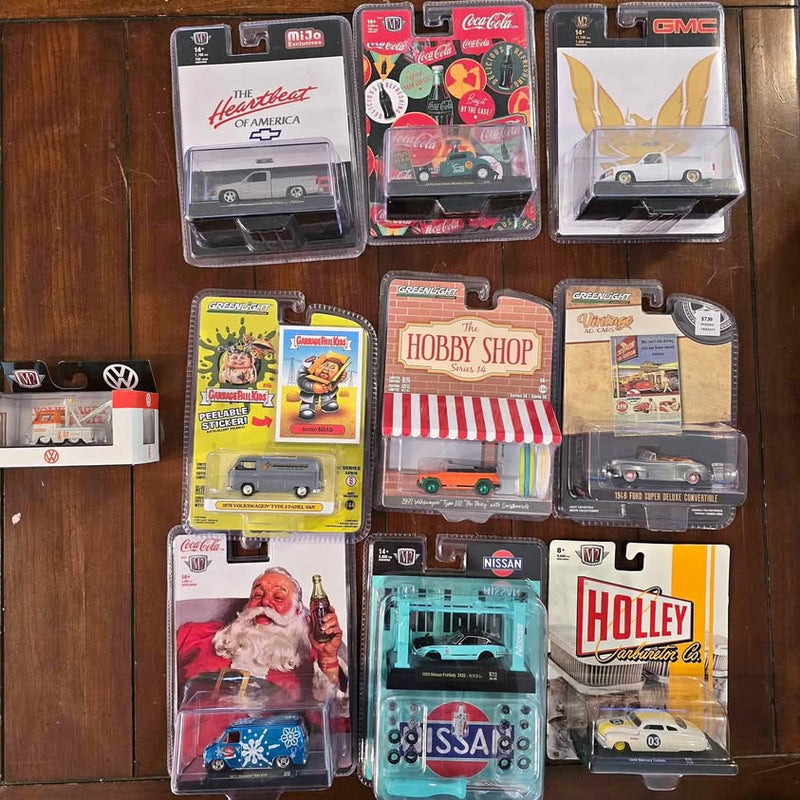 Diecast car models in clear blister packaging on cards, assorted designs