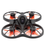 Micro FPV racing drone with black frame and orange quad propellers, front camera module