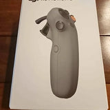 Gray motion drone controller with circular thumb sensor and side buttons