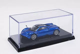 Blue diecast sports car model in clear display case, 1/64 scale.