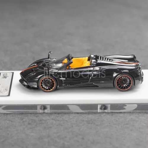Black convertible sports car diecast model with orange interior detailing