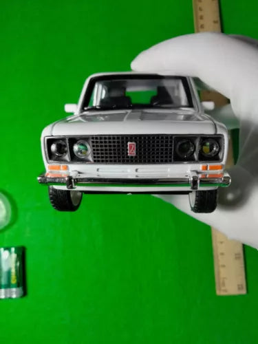 Classic Soviet diecast car model, front grille and headlights, gray