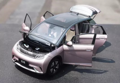 Pink diecast electric car model with hood open and front door open, 1/18 scale