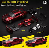 Red 1:36 modified diecast model sports car with engine and fender parts