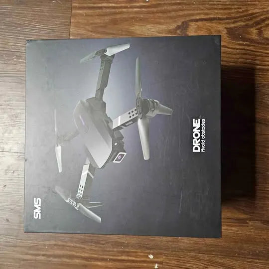 Drone in box with illustration on black packaging