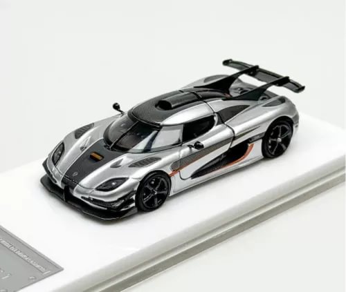 Silver and black diecast super racing model car with black wheels and rear wing