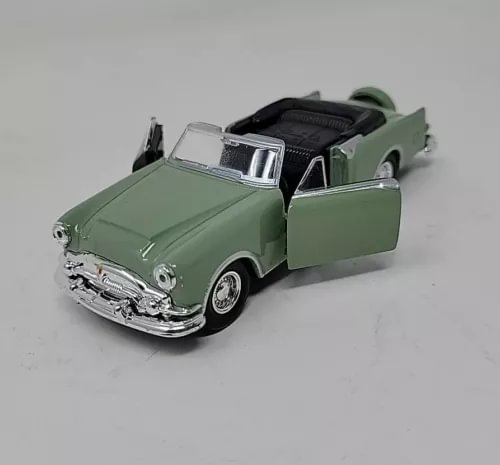 Green convertible diecast model car with open doors, chrome details, 1:34–1:39 scale