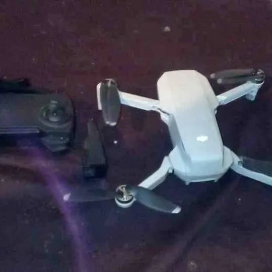 Dji Mavic Mini drone with four propeller arms