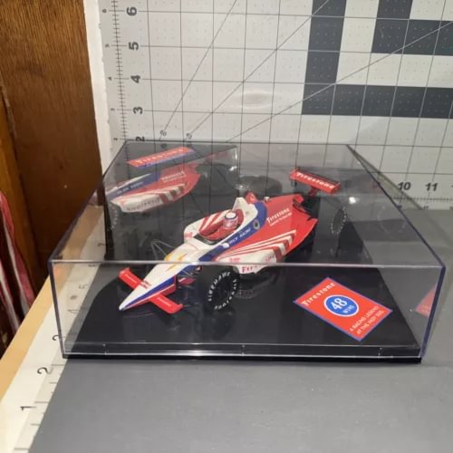 1:24 scale diecast race car in clear display box, red white blue livery