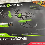 Green and black quadcopter stunt drone with four propellers