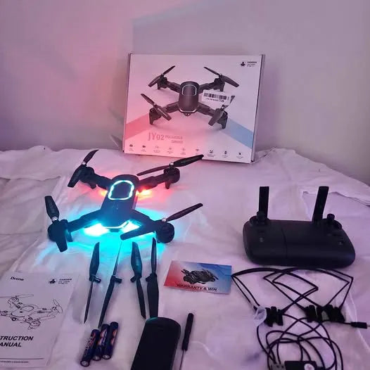 Foldable quadcopter drone with bright LED lights and four propeller arms