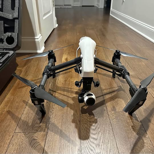 DJI Inspire 1 V2 drone with white body and four black propeller arms