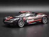 Diecast model car with orange racing stripes and brembo logo, silver-gray wheels