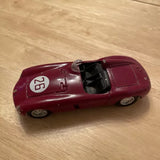 Maroon vintage race diecast model car with open cockpit and front hood details