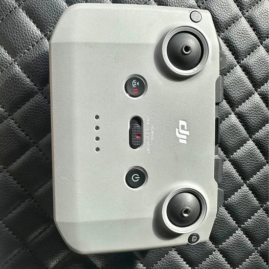 DJI RC 231 drone controller with thumb wheels and button panel, light gray