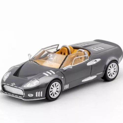 1/64 scale grey diecast sports car model, tan interior, open cockpit